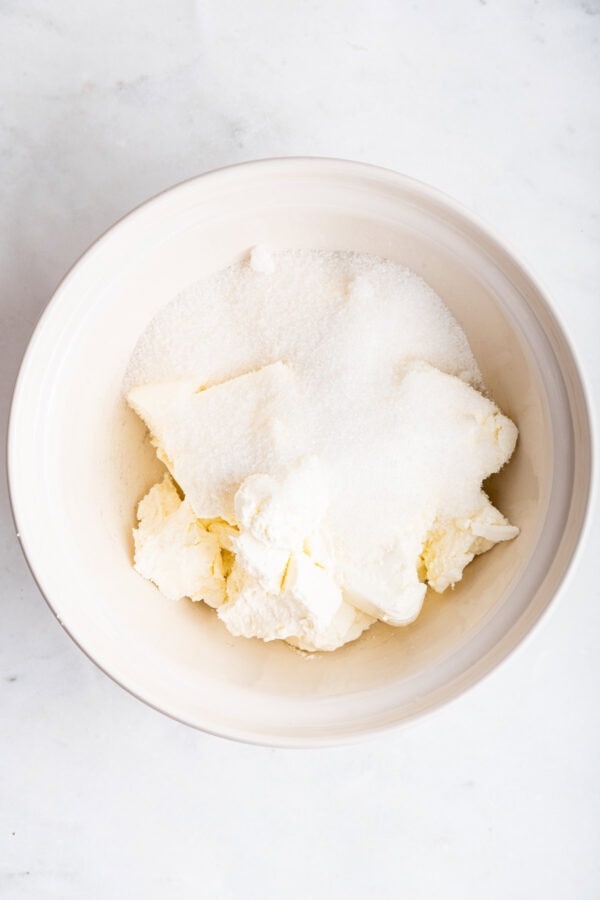 cream cheese an sugar in a mixing bowl.