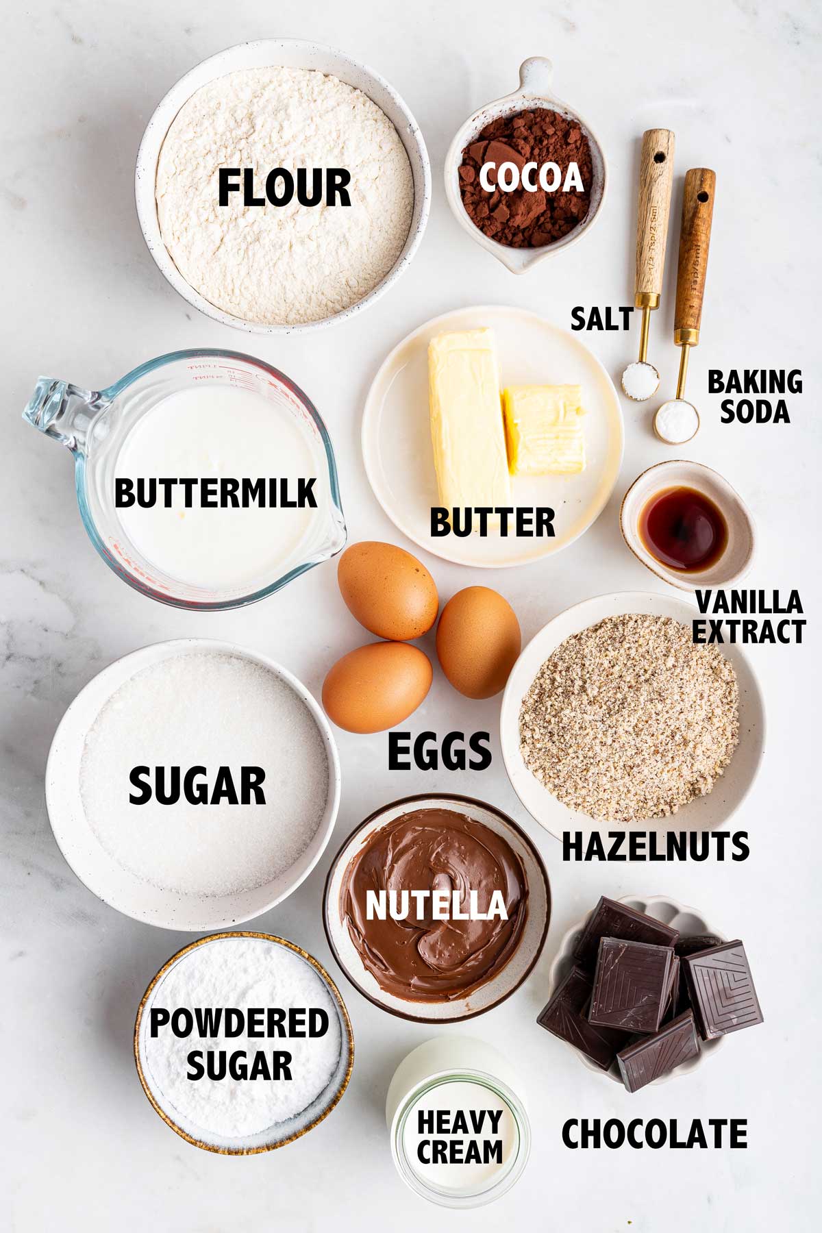 overhead view of the ingredients used to make a chocolate hazelnut cake.