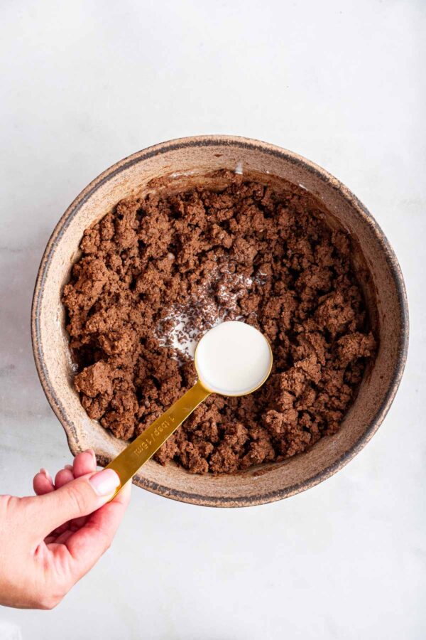 adding heavy cream to nutella buttercream frosting.