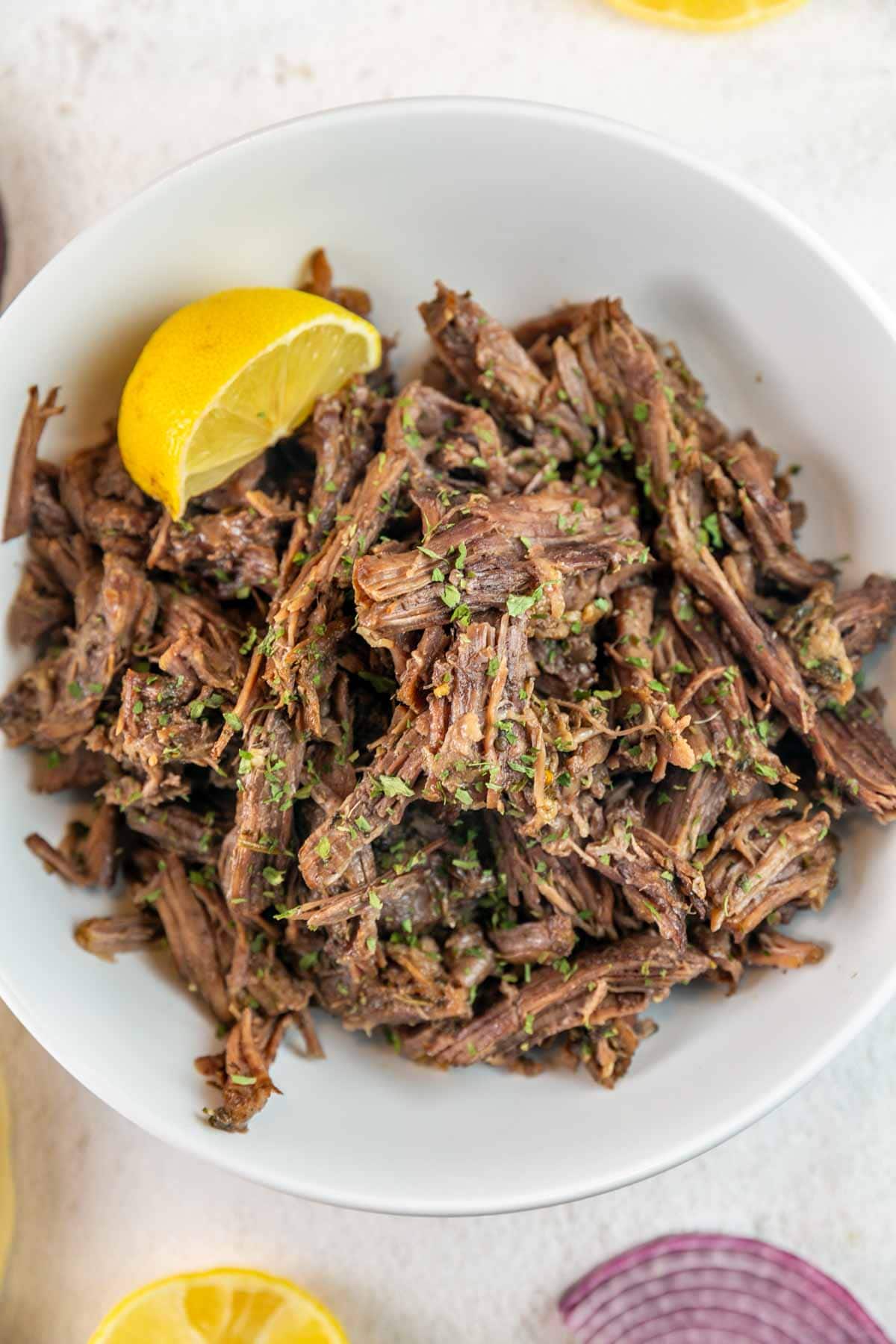 bowl filled with shredded beef made in an instant pot.
