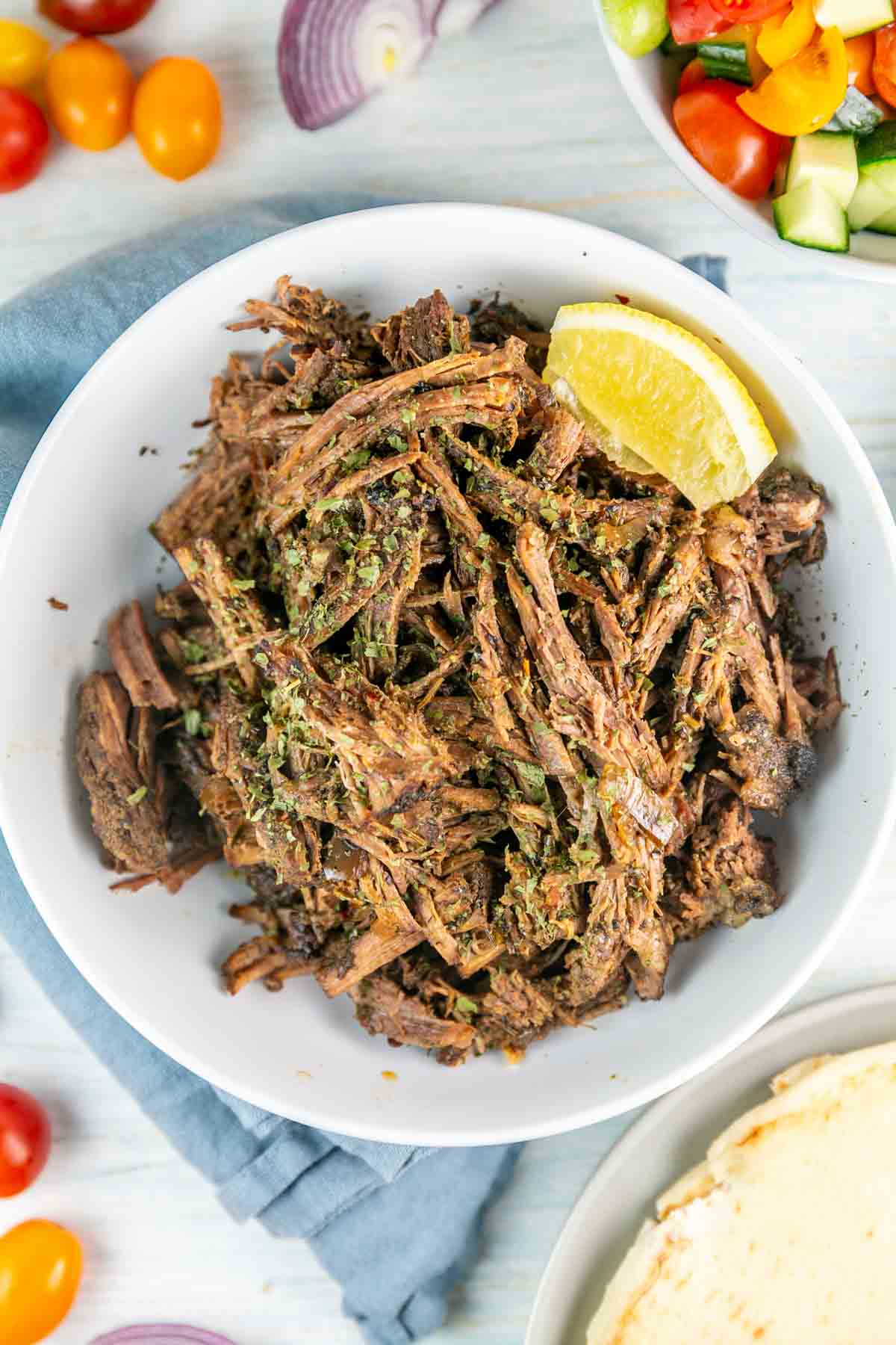 a bowl of shredded beef for homemade gyros.