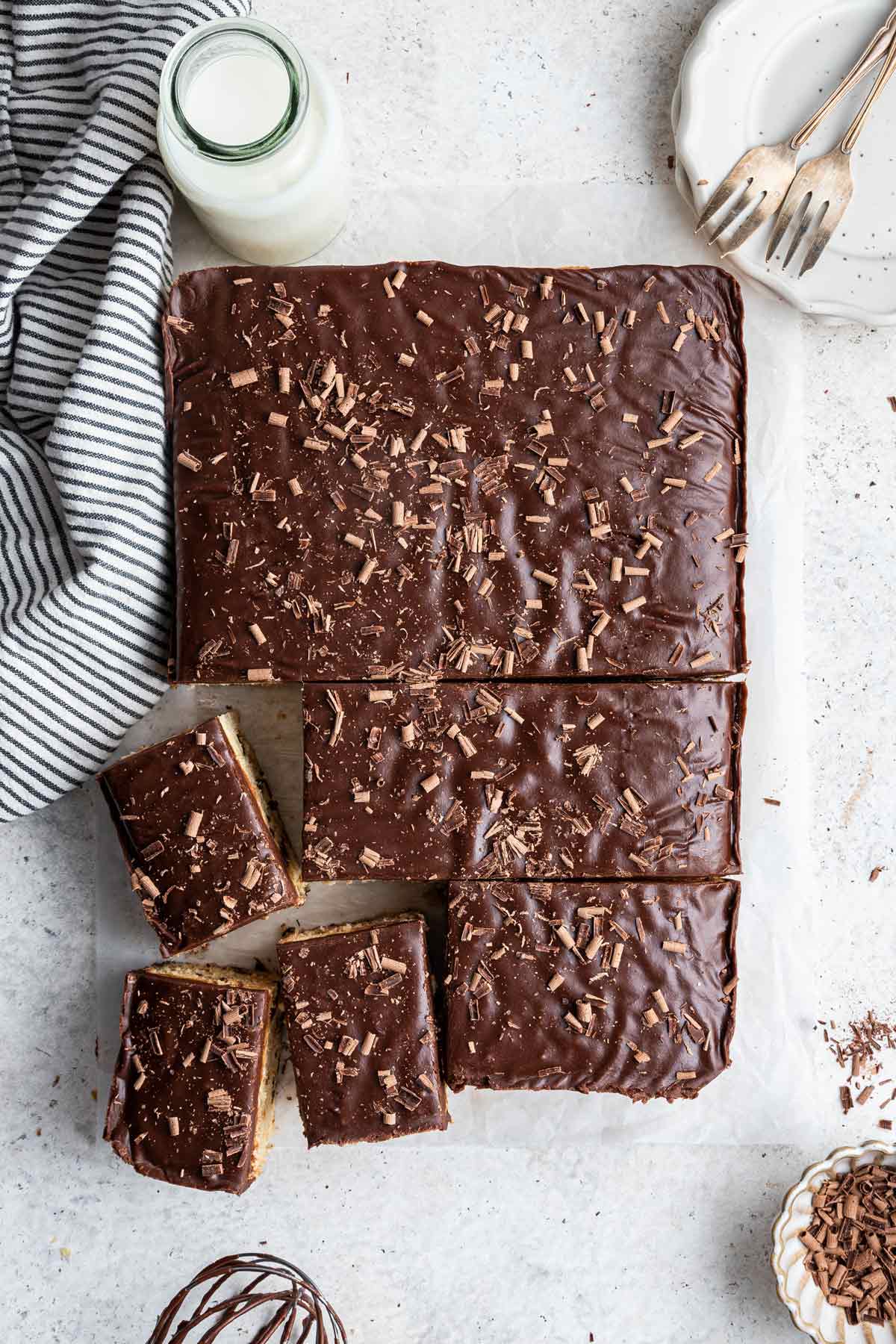 chocolate chip sheet cake covered in a hot fudge frosting and shaved chocolate.