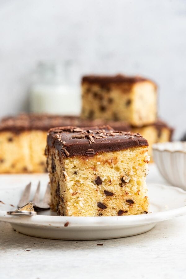 slice of chocolate chip sheet cake on a desert plate.