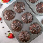 dark chocolate muffins filled with chopped strawberries.