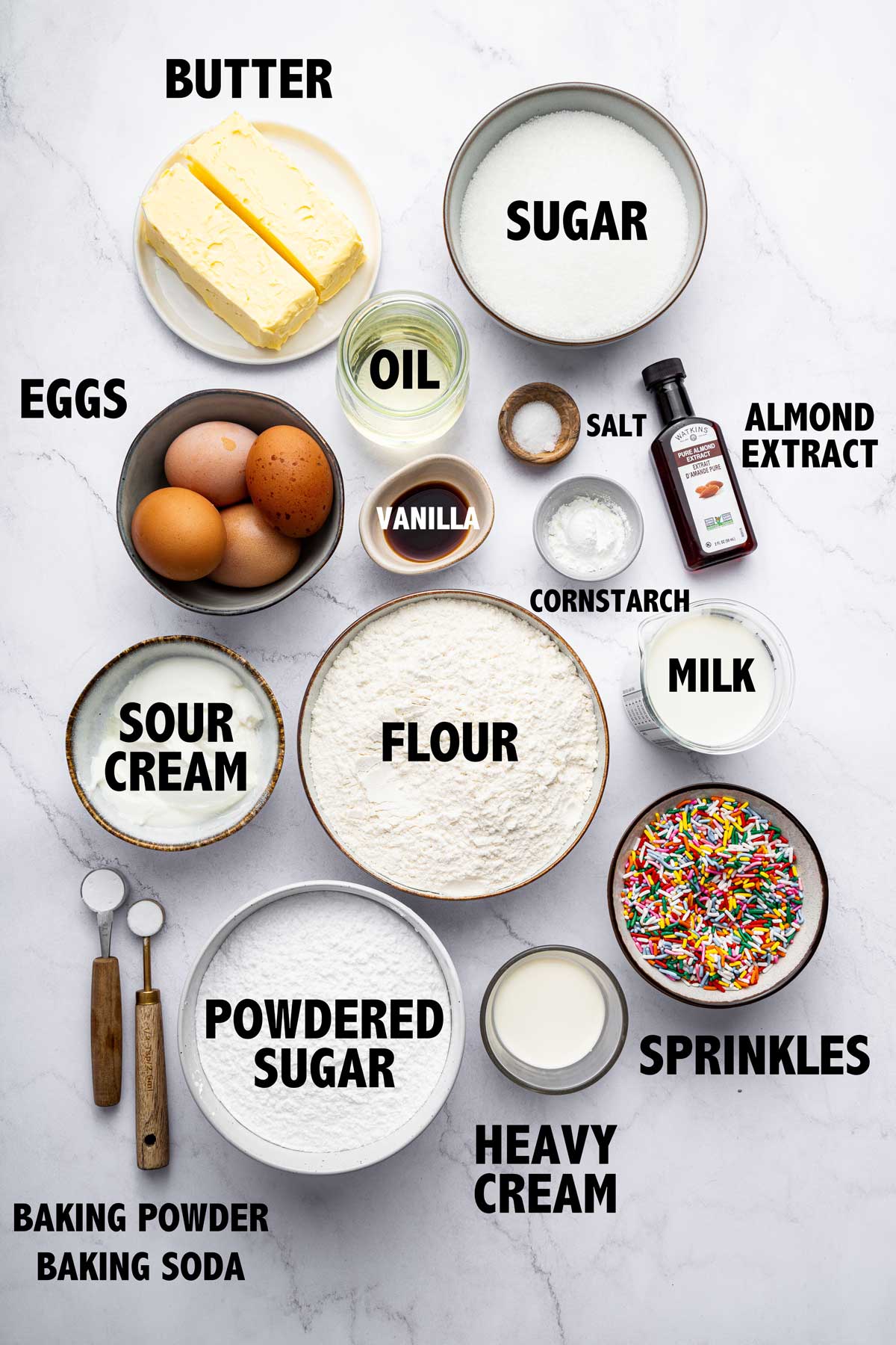 overhead photo of the ingredients used to make a funfetti sheet cake.