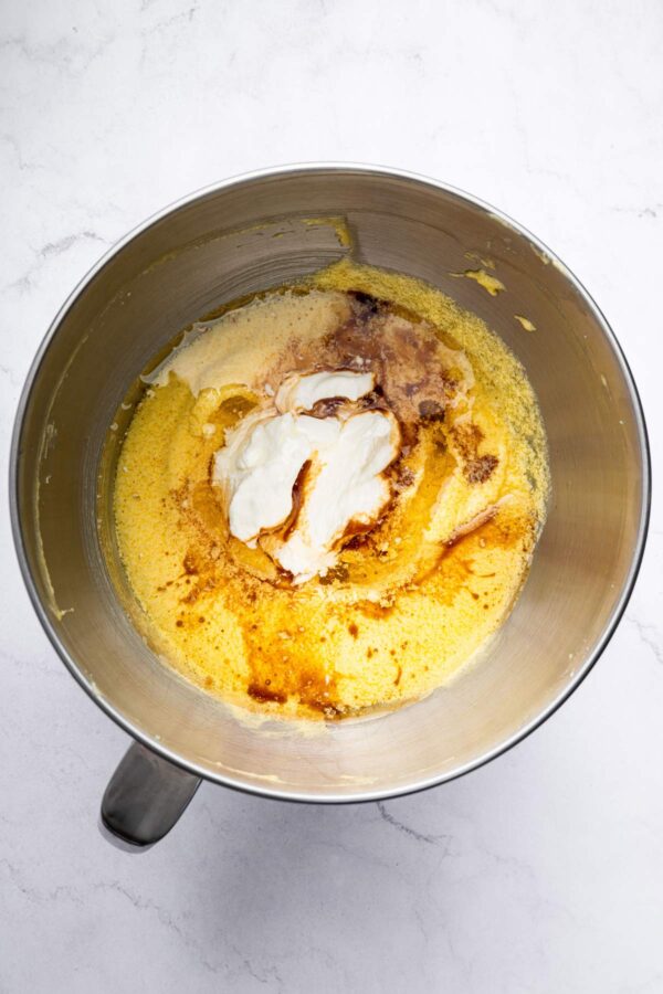 adding sour cream and oil to cake batter.