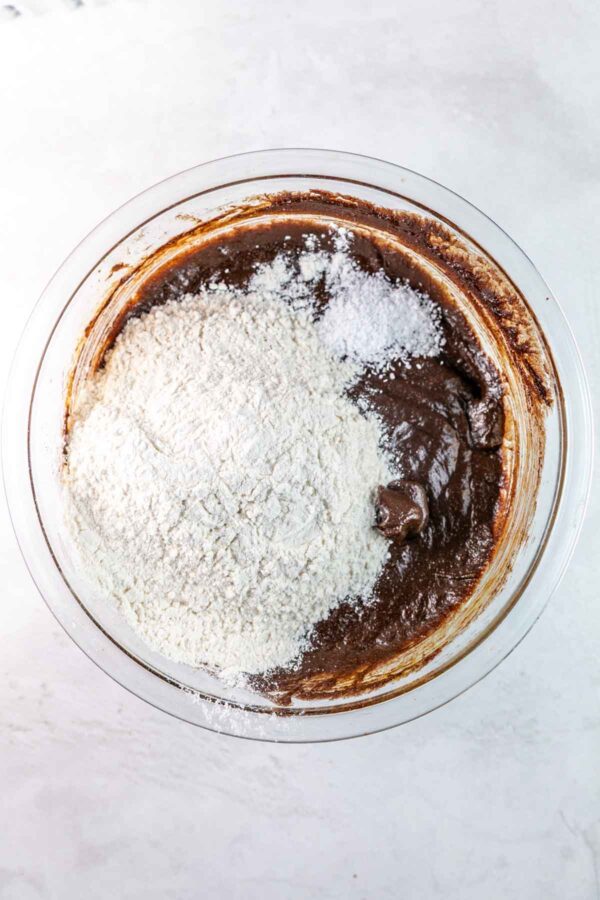 mixing flour into brownie batter.