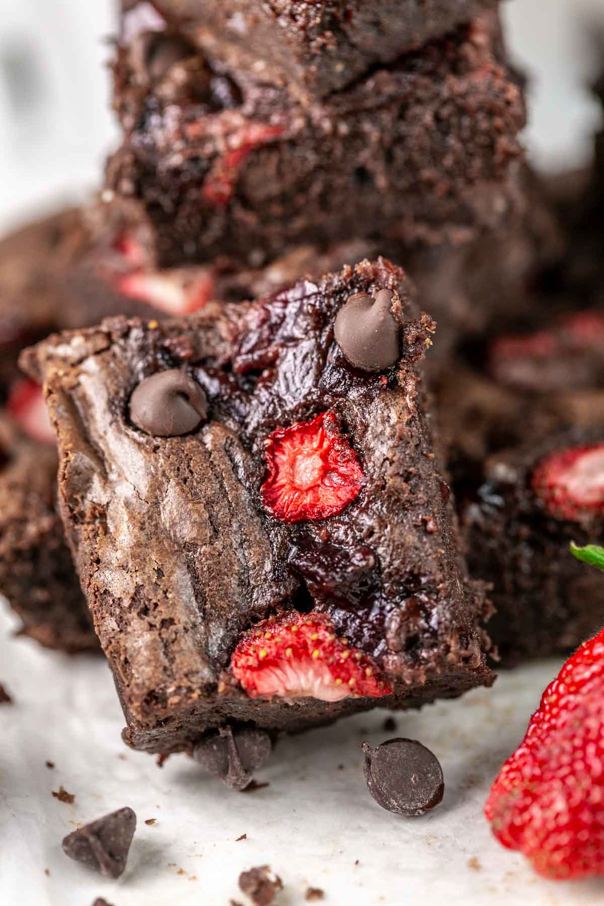 close up view of a brownie showing the strawberry jam on the surface.