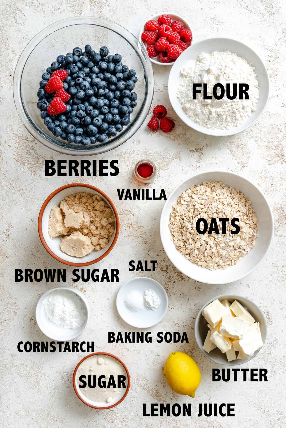 overhead view of ingredients used to make berry oatmeal crumble bars.