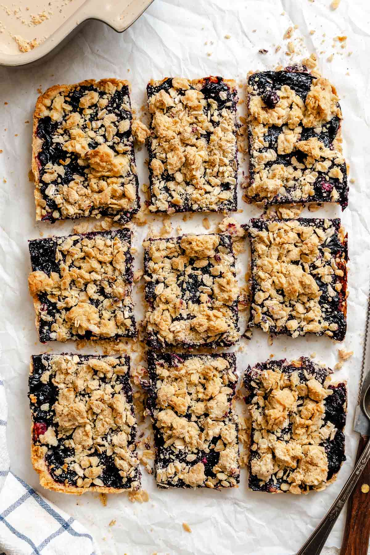 berry oatmeal bars with a golden crumble topping.