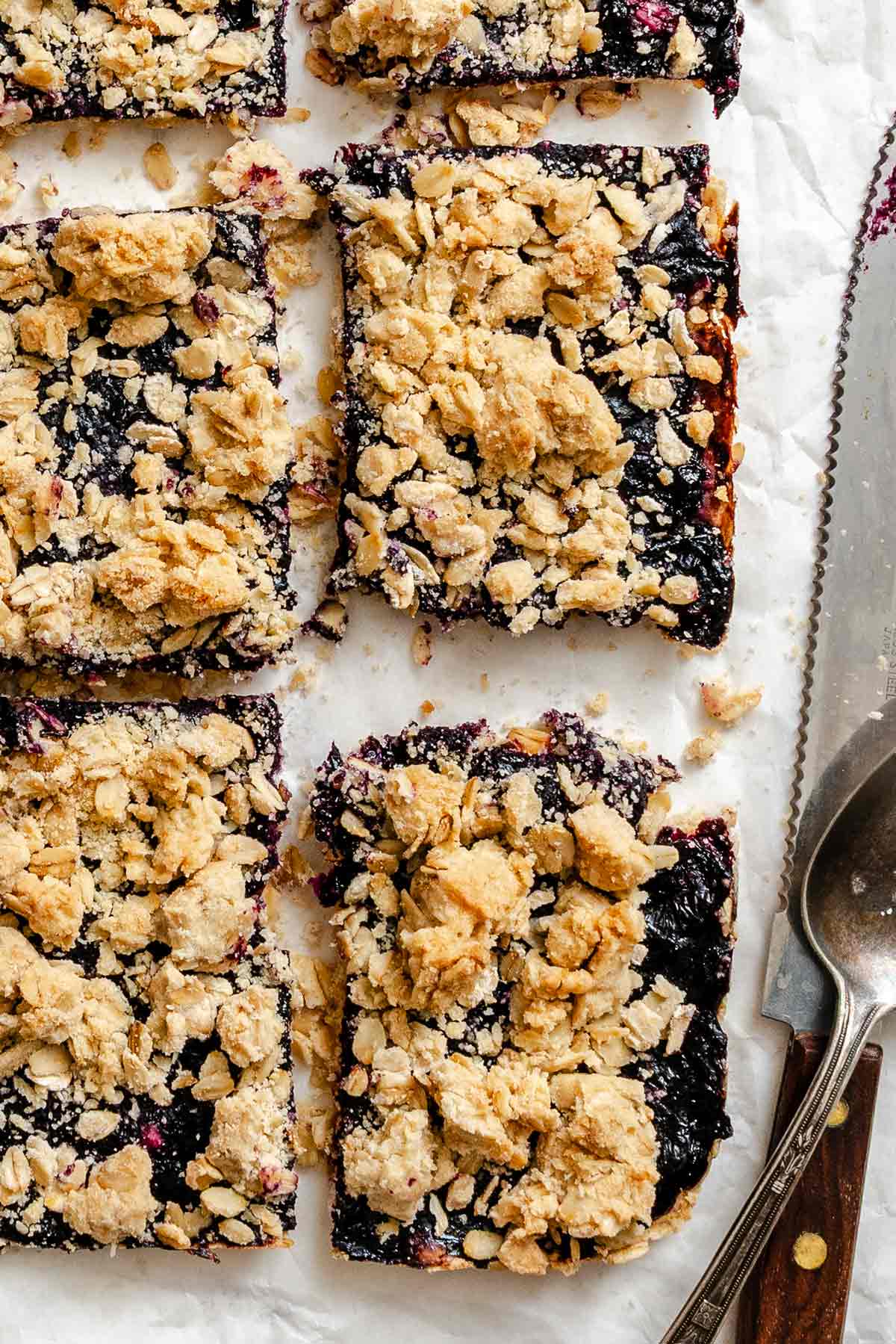 homemade blueberry raspberry fruit bars with a golden oatmeal crumble topping.