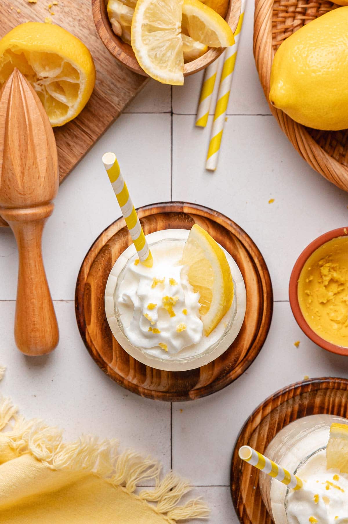 overhead view of a frozen lemonade topped with a fluffy pile of whipped cream.
