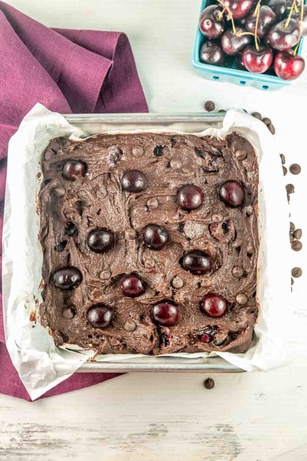 brownies topped with halved cherries before baking.