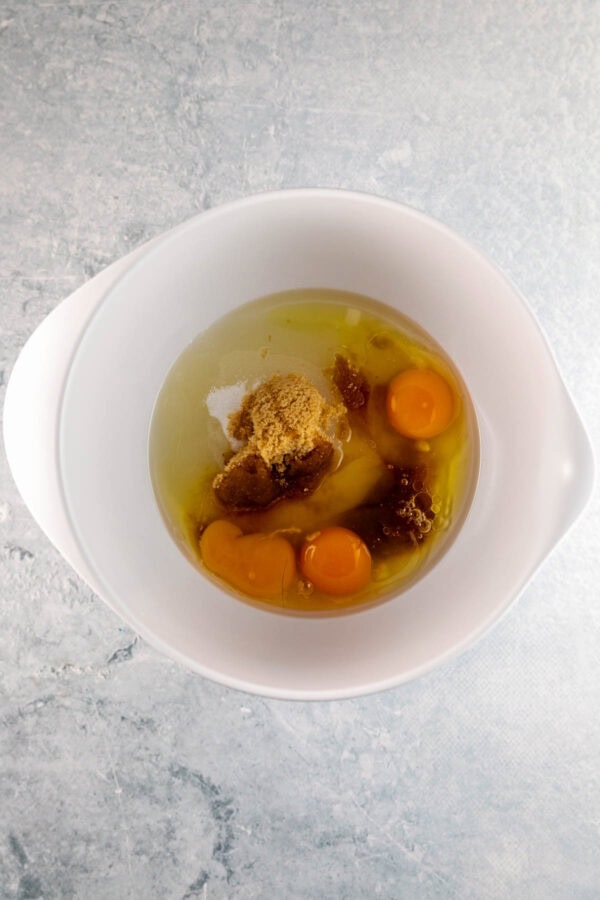 eggs, oil, and sugar in a mixing bowl.