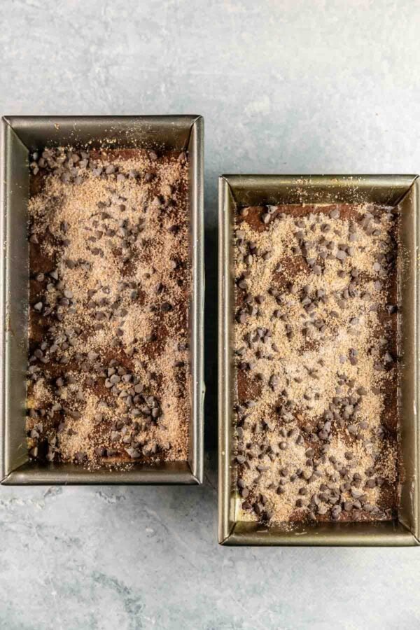 cinnamon streusel topping on two loaves of zucchini bread.