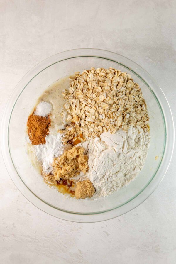 adding dry ingredients to banana muffin batter.