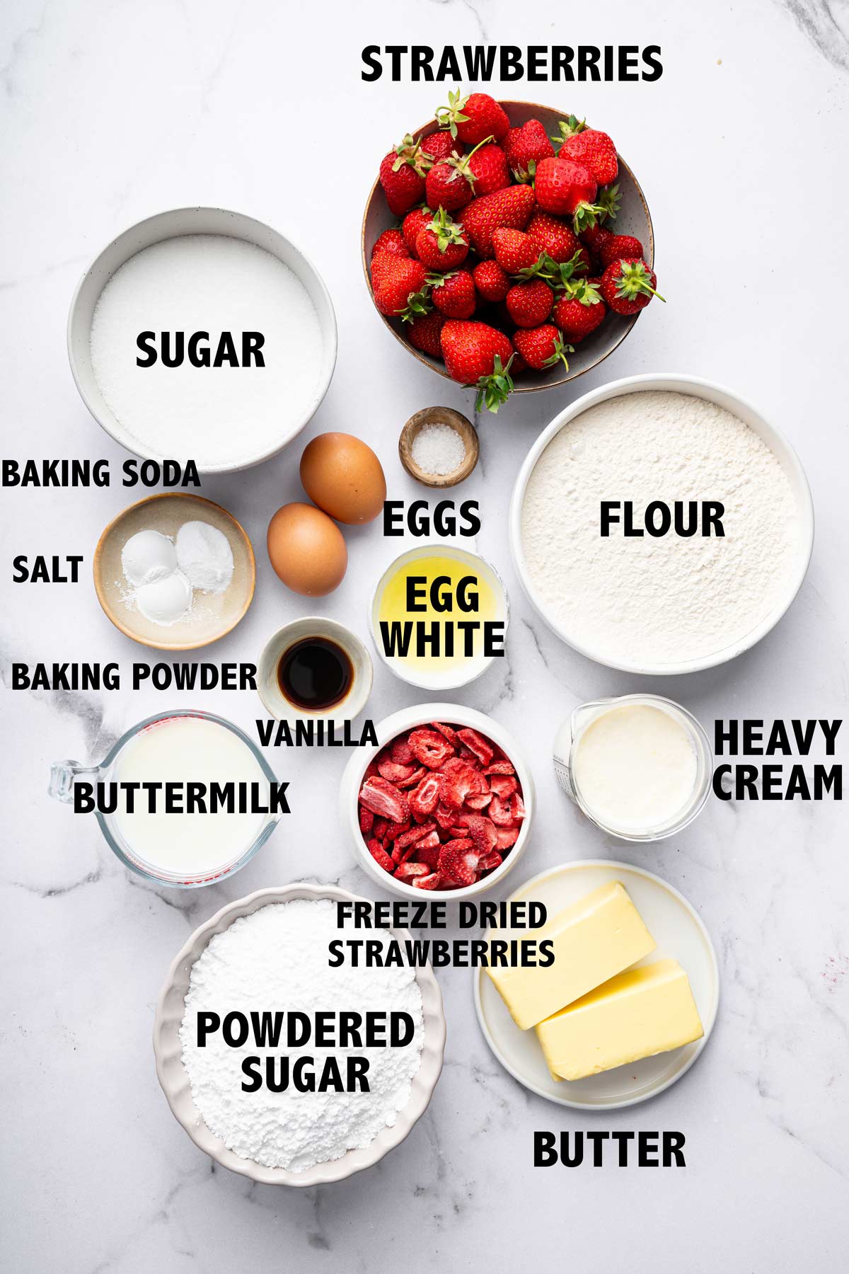 overhead view of ingredients used to make a strawberry sheet cake.