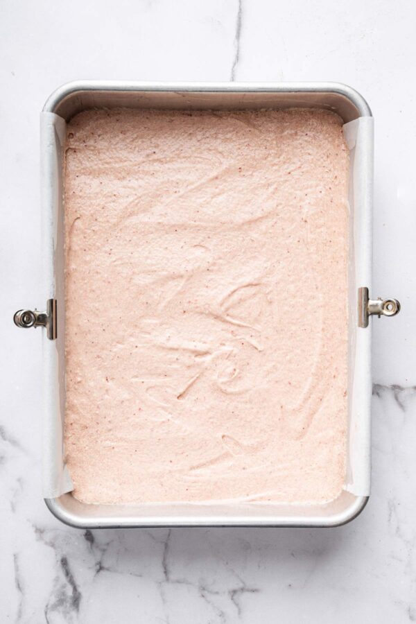 cake batter poured into a 9x13-inch baking pan.