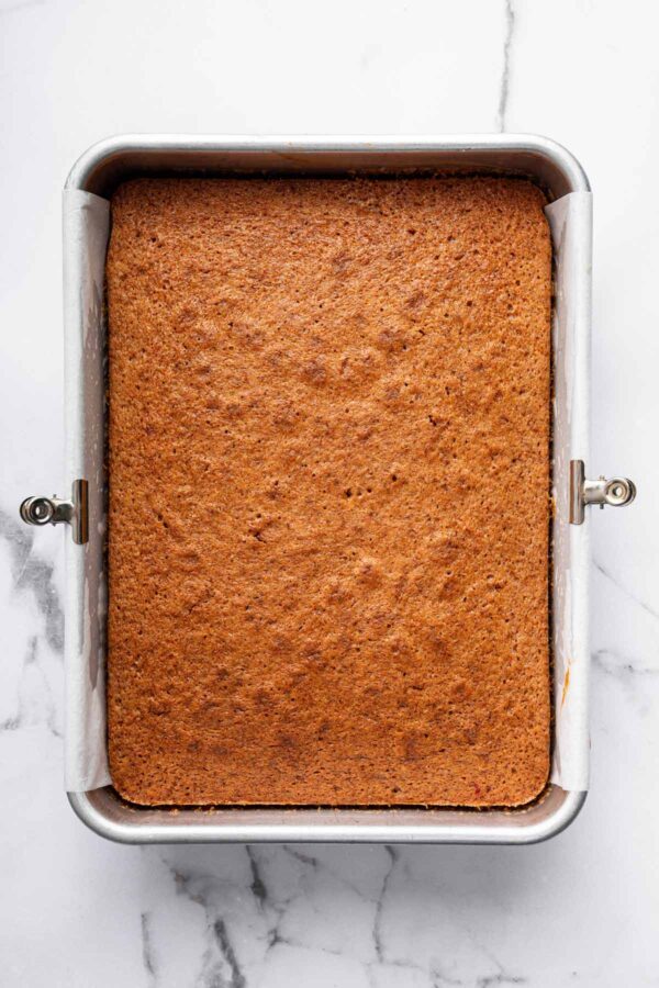 strawberry sheet cake still in the baking pan.