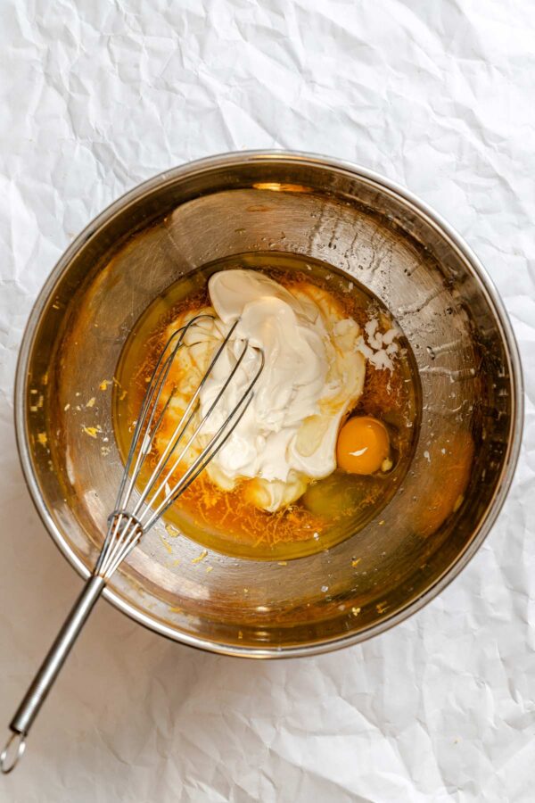 wet ingredients to make grapefruit bread in a metal mixing bowl.