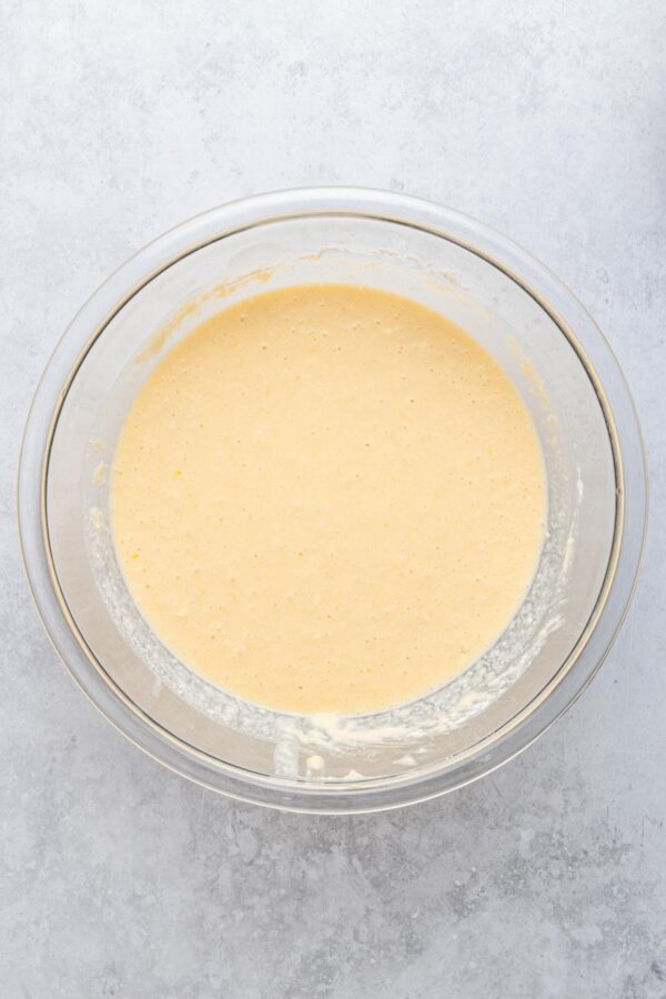 smooth ricotta lemon pancake batter in a mixing bowl.