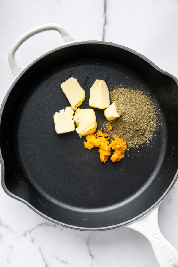 butter, dried herbs, and orange zest in a saute pan.
