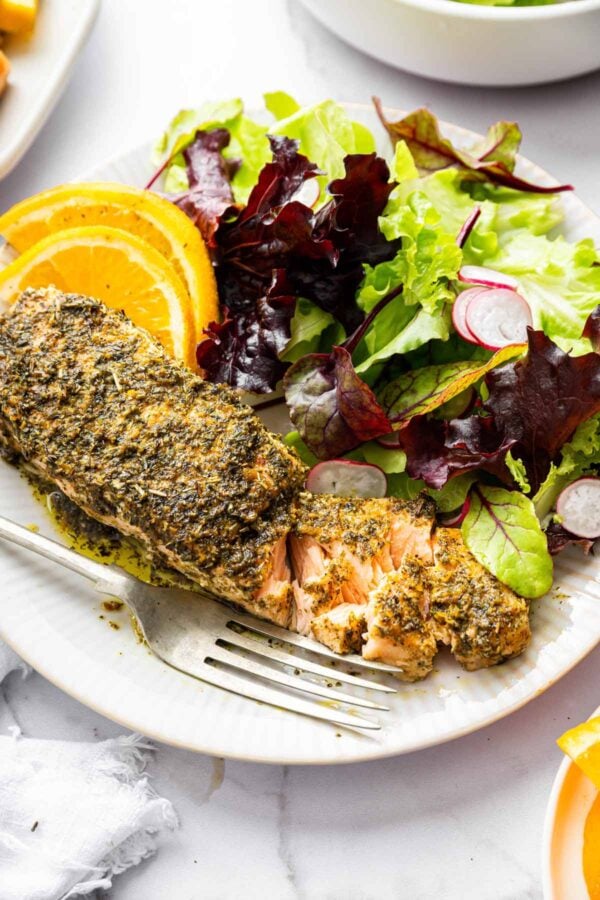 flaked oven roasted salmon showing the perfectly cooked interior.