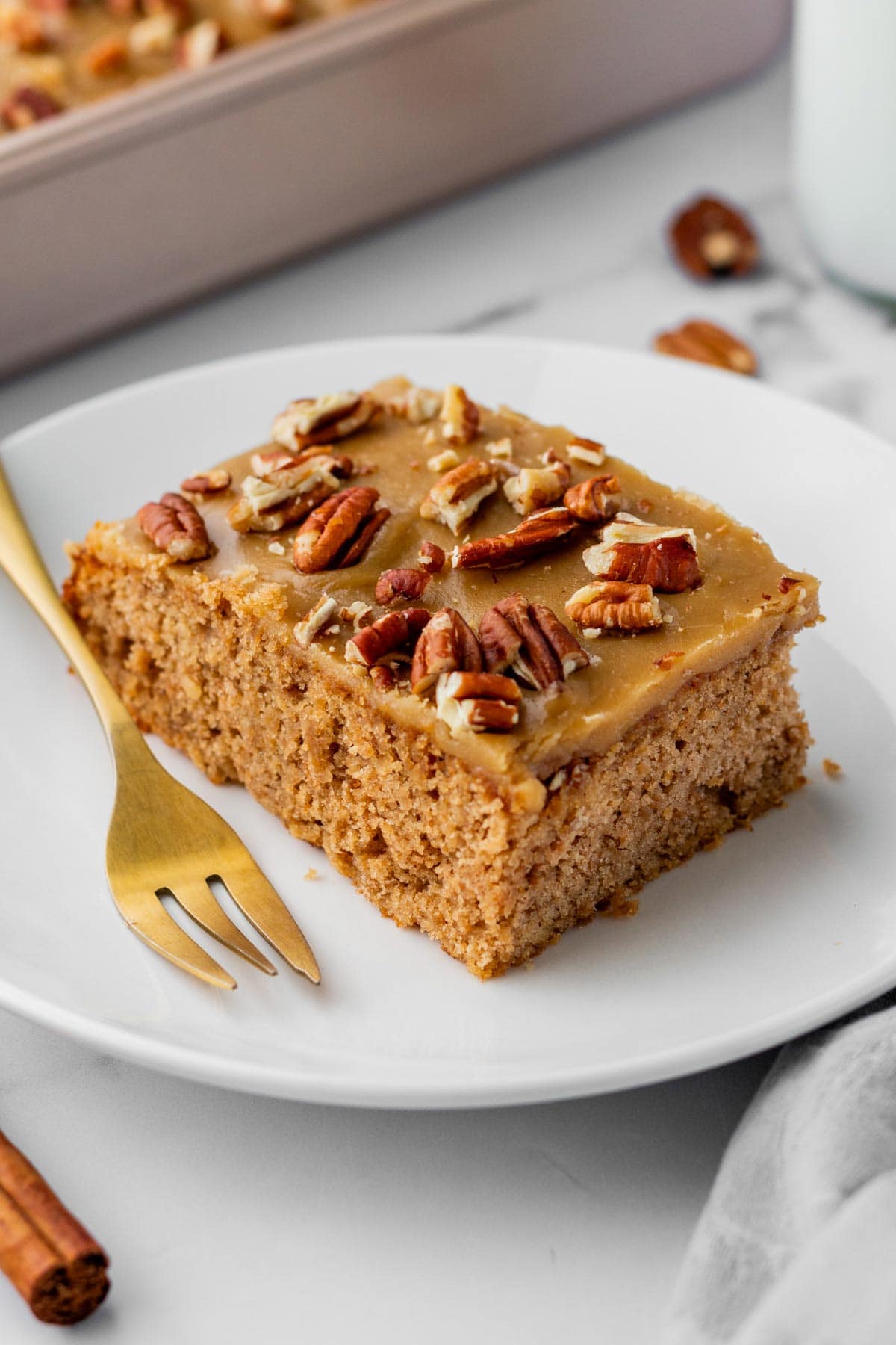 slice of applesauce sheet cake on a dessert plate.