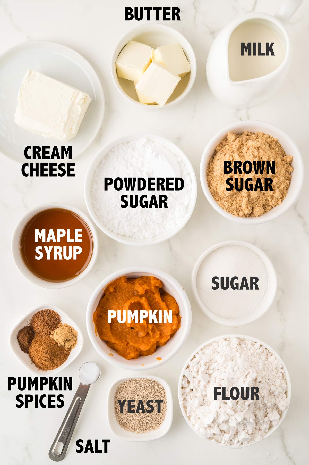 overhead view of ingredients used to make pumpkin cinnamon rolls.