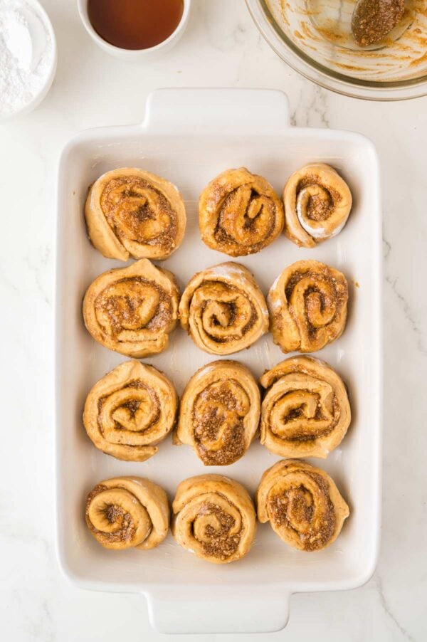 pumpkin cinnamon rolls cut into 12 rolls of dough.