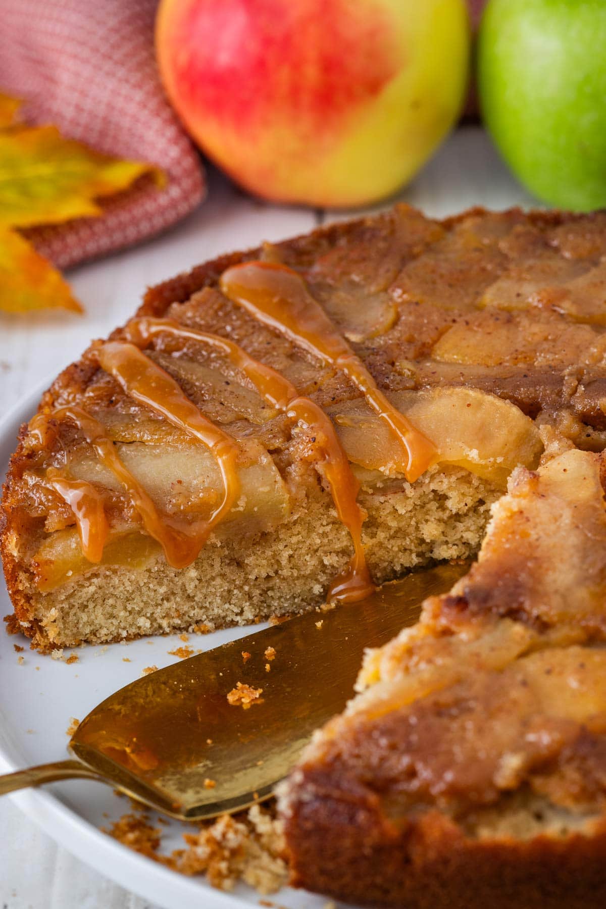 caramel drizzled on top of an apple upside-down cake.