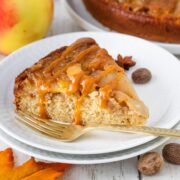 slice of apple upside-down cake drizzled with caramel.