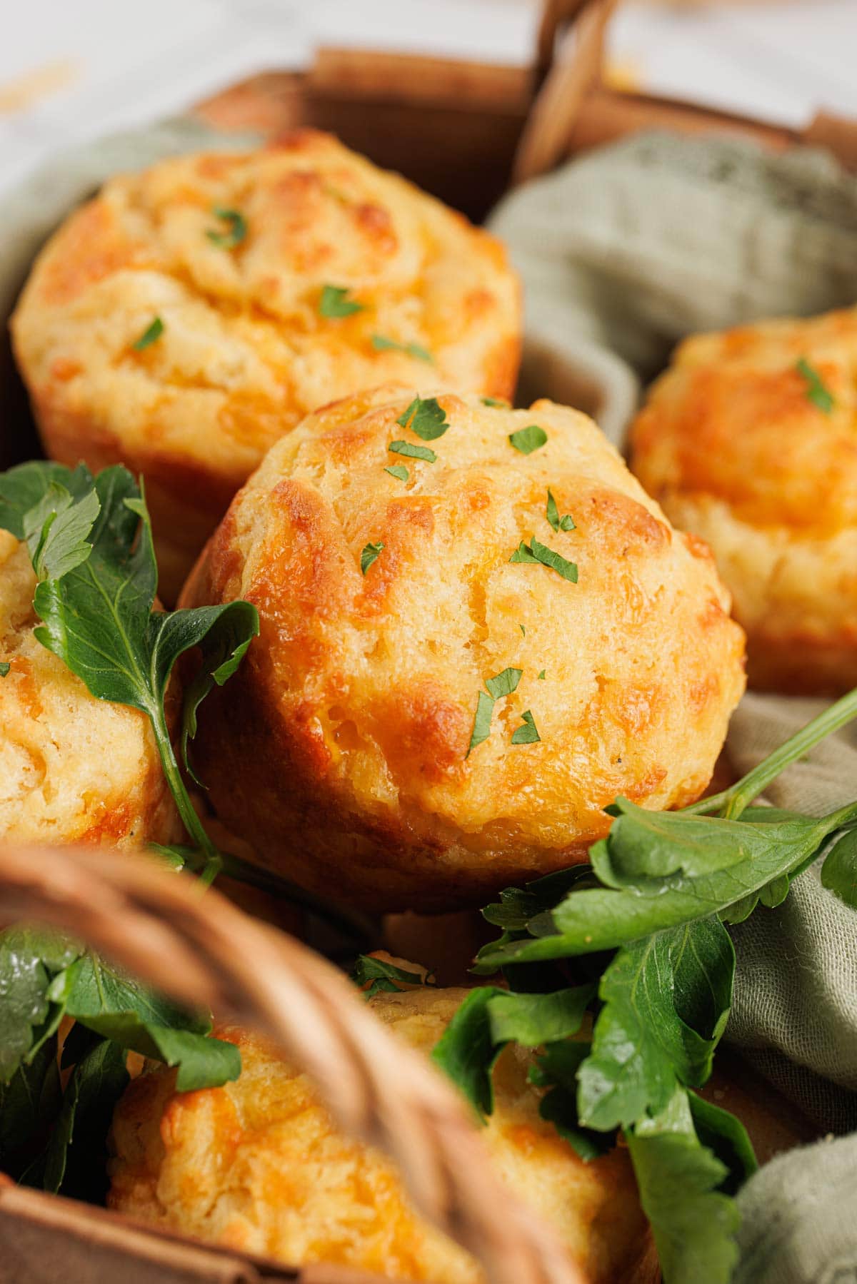 basket full of freshly baked homemade cheddar bay biscuits.
