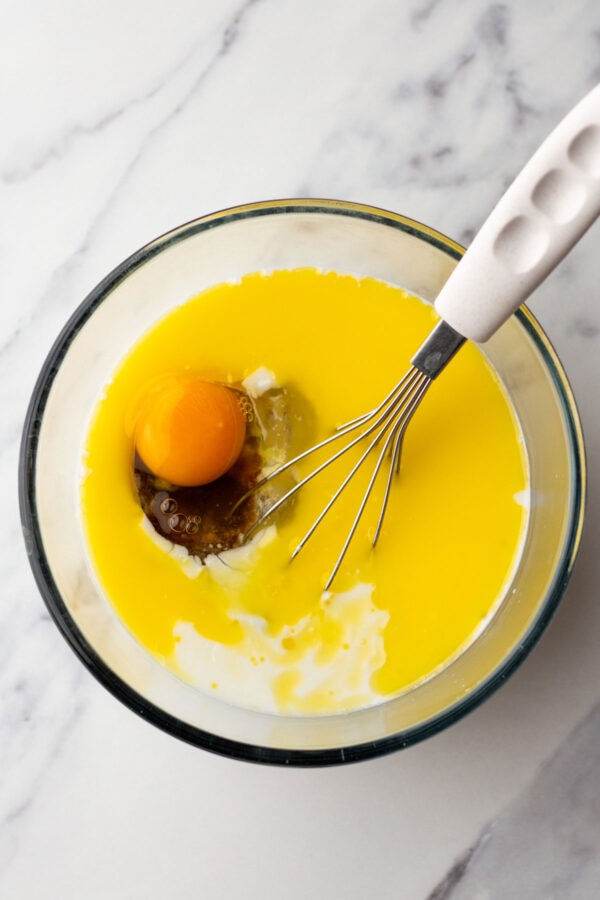 wet ingredients for pancakes in a mixing bowl.