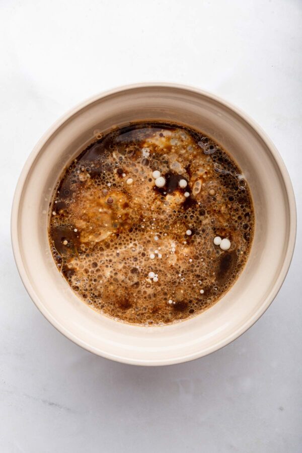 whisking together buttermilk, eggs, coffee, and vanilla extract.