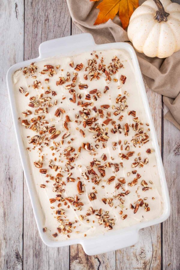 pumpkin sheet cake topped with toasted pecans.