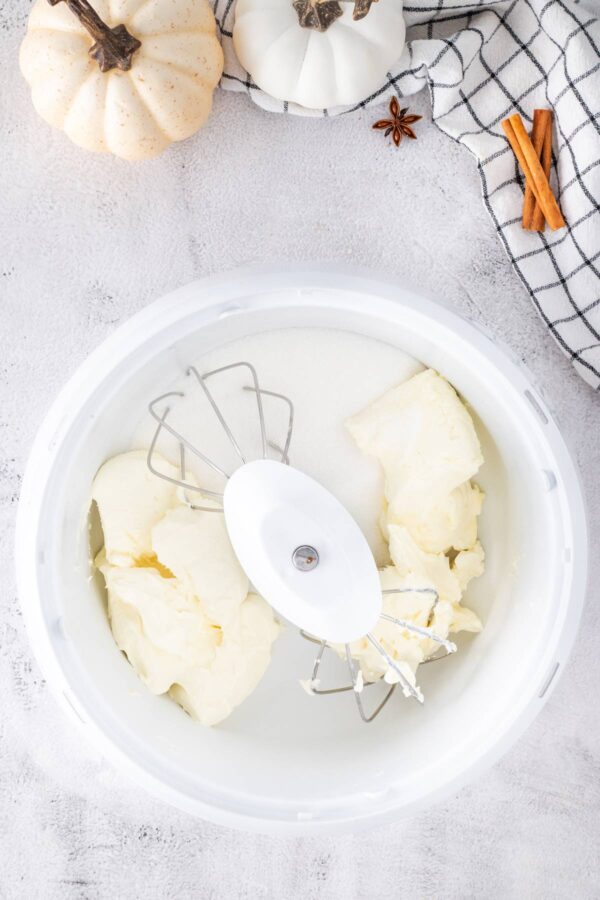 cream cheese and sugar in a mixing bowl.