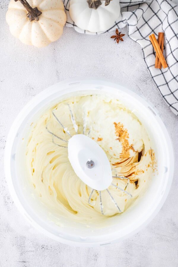 mixing batter for a vanilla cheesecake.