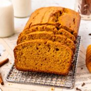 loaf of sweet potato quick bread on a cooling rack.