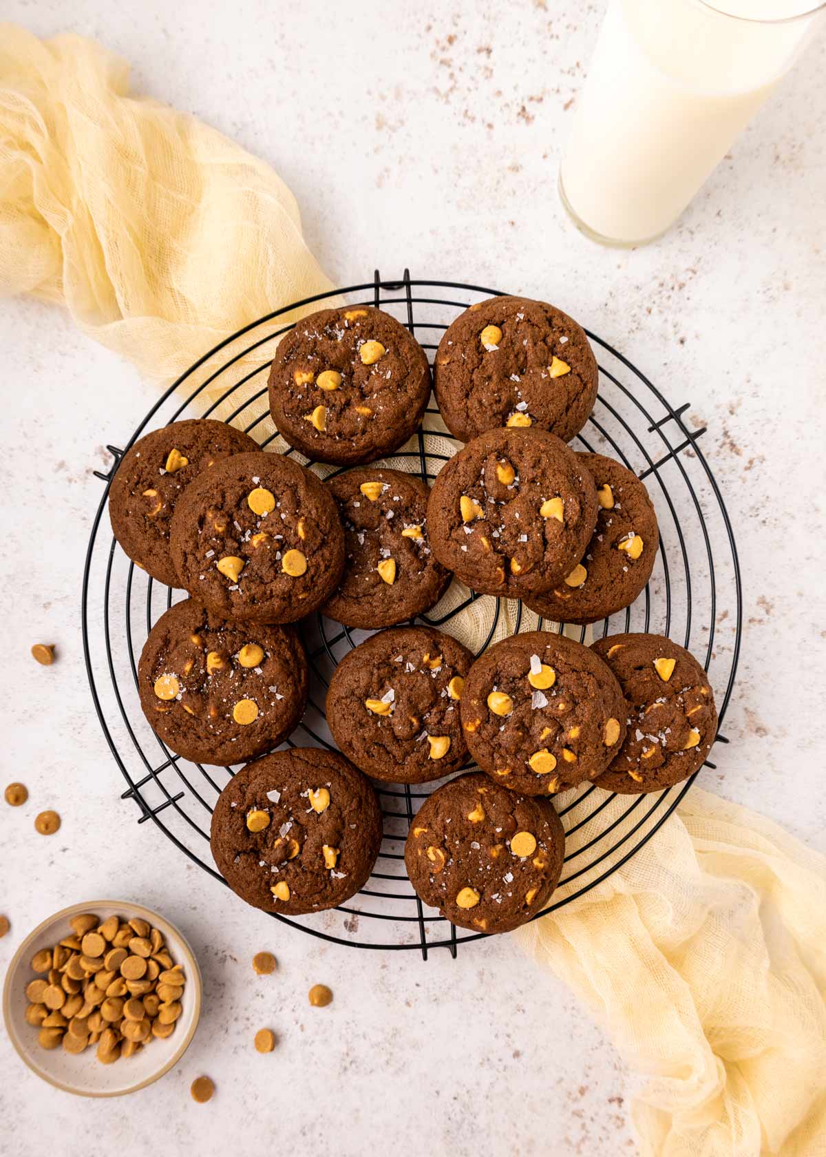 chocolate peanut butter chip cookies on a wire cooling rack.