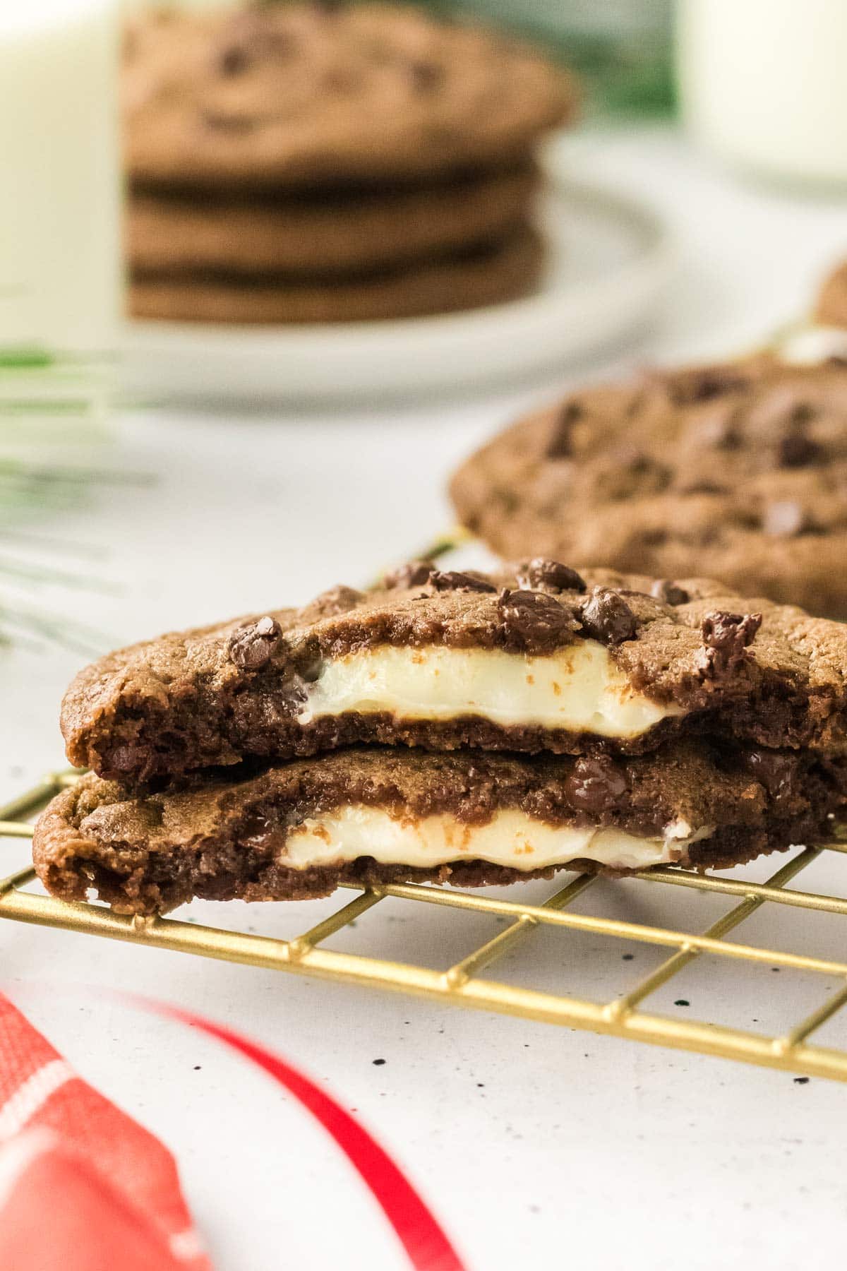 giant chocolate cookie cut in half to show the creamy cheesecake filling inside.