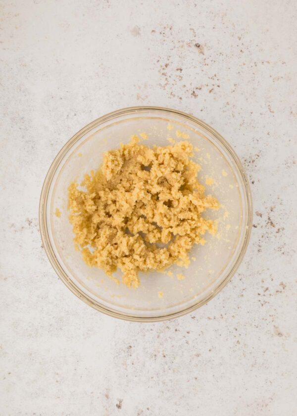 creaming butter and sugar in a mixing bowl.