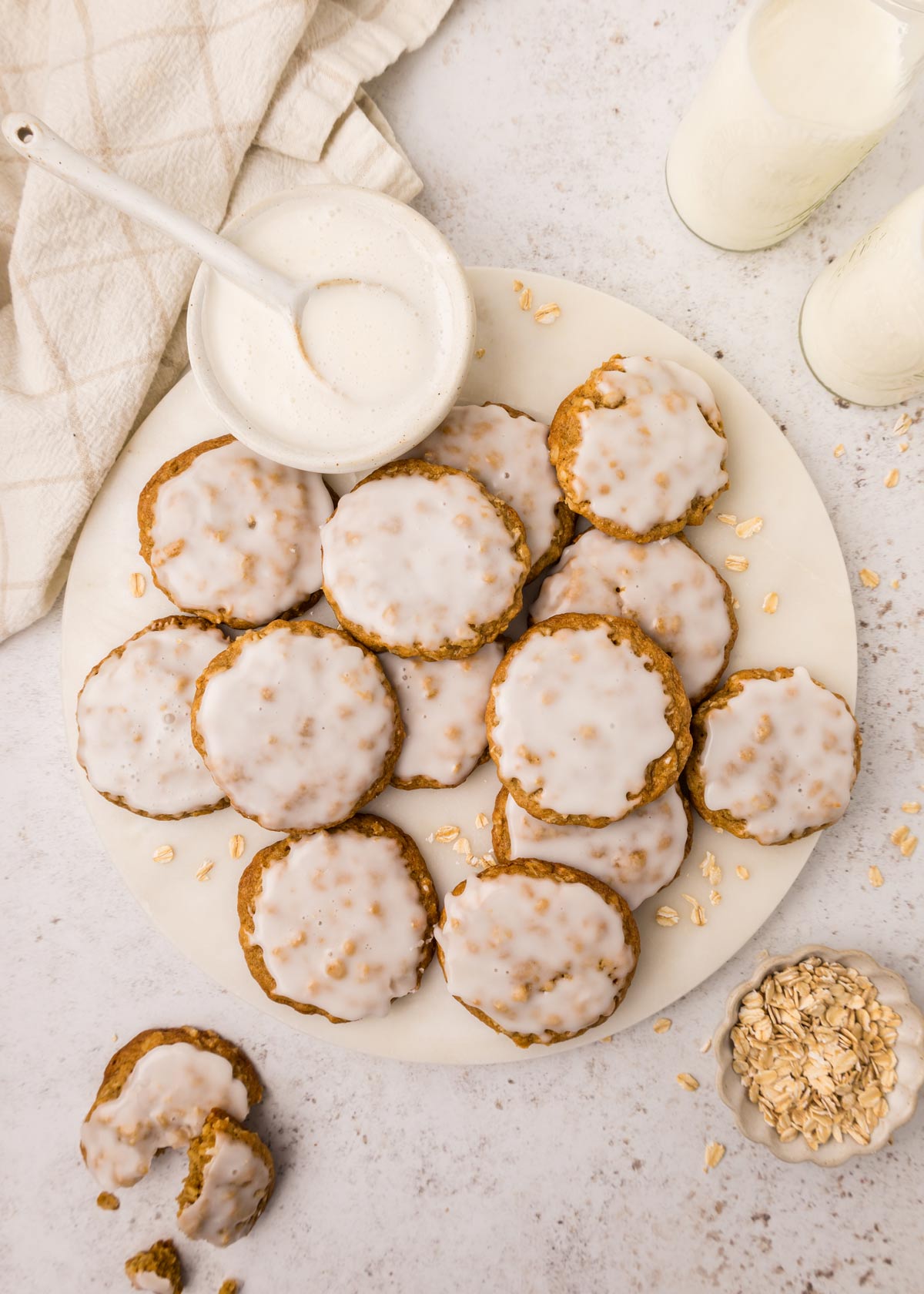 serving tray covered with iced oatmeal cookies.