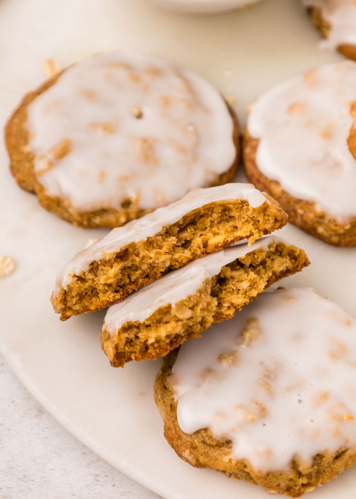 oatmeal cookie broken in half to show the chewy interior.