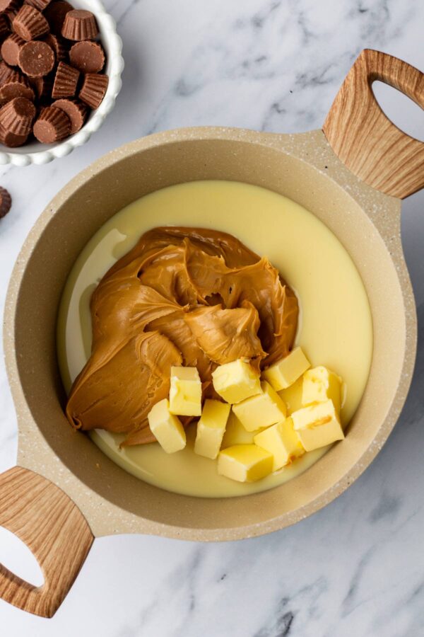 peanut butter, butter, and condensed milk in a saucepan.