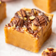 square of peanut butter fudge with chopped peanuts and drizzled chocolate.