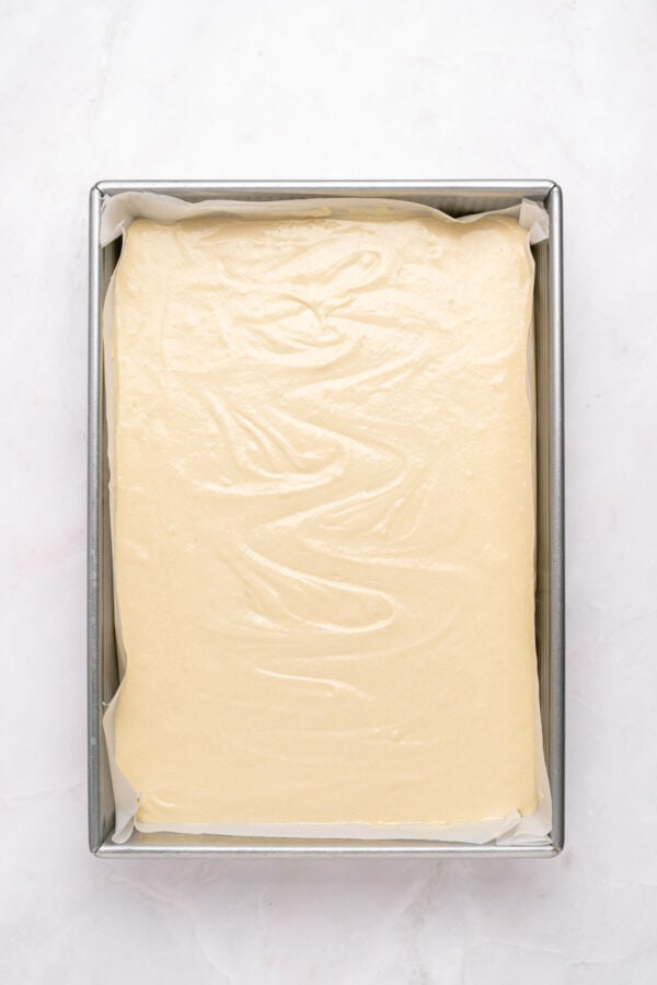 vanilla cake batter in a 9x13-inch baking pan.
