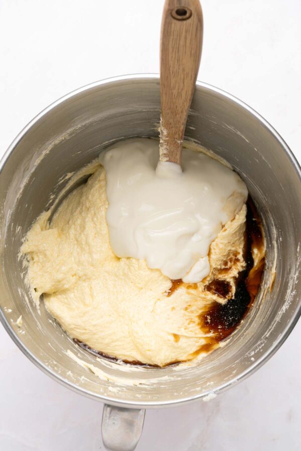 mixing sour cream and vanilla into cake batter.