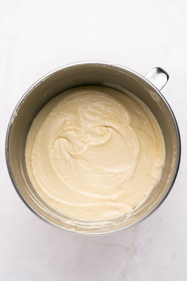 vanilla cake batter in the bowl of a stand mixer.