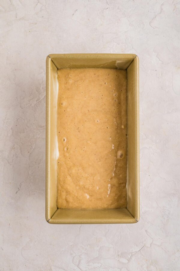 quick bread batter poured into a loaf pan.